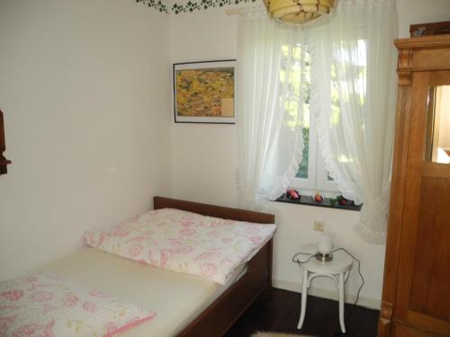 Postel nebo postele na pokoji v ubytování Villa Luzia