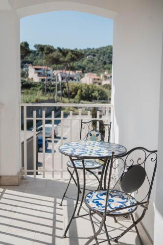 a table and chairs on a balcony with a view at Hotel Ficocella in Palinuro