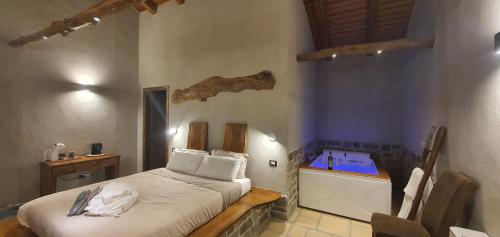 a bedroom with a bed and a sink in it at Pietre di Fiume in Apice