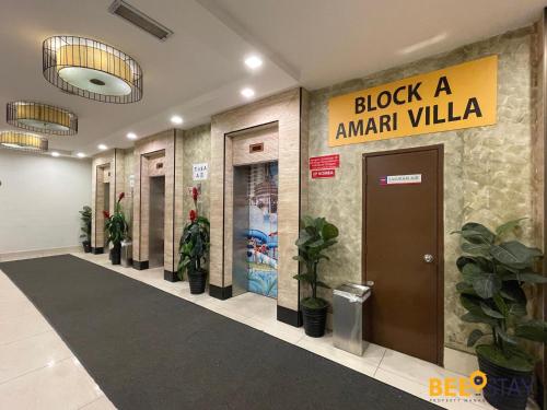 a lobby with a row of doors and potted plants at Melaka Bayou Lagoon Free 4 Waterpark Tickets! in Kampong Bukit Beruang