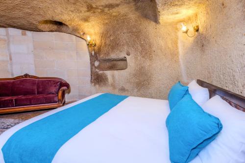 Postel nebo postele na pokoji v ubytování ARIEN CAVE Hotel