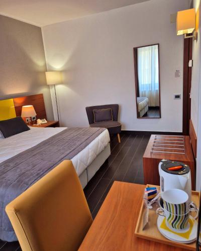 Una cama o camas en una habitación de Hotel Sandalia