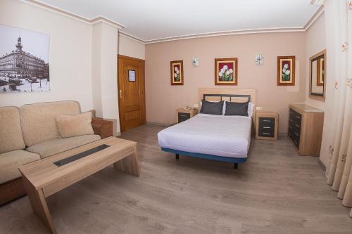 Postel nebo postele na pokoji v ubytování Hostal El Cruce