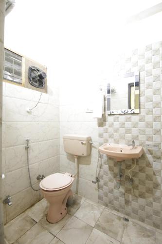 Koupelna v ubytování Hotel Satyam Swagat