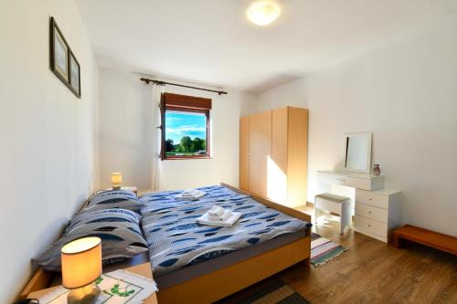 En eller flere senge i et værelse på Matanovi Dvori