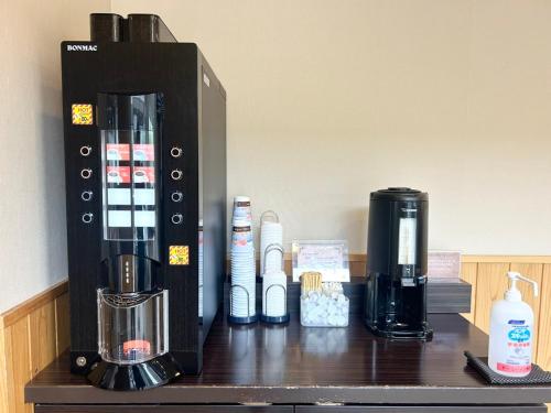a coffee maker sitting on a counter in a room at Dormy Inn Akita in Akita