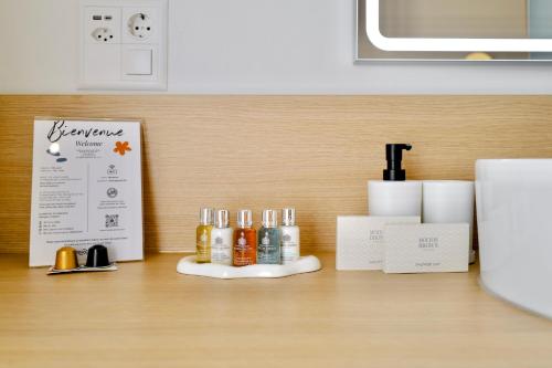 a counter with bottles of alcohol on a table at Rhodania Boutique Hôtel in Geneva