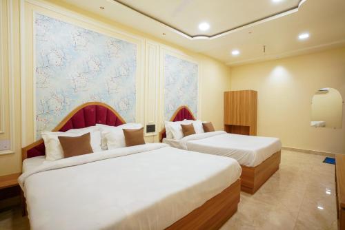 Hotel Al Aziz Palace 30 Mts from Dargah Sharifにあるベッド