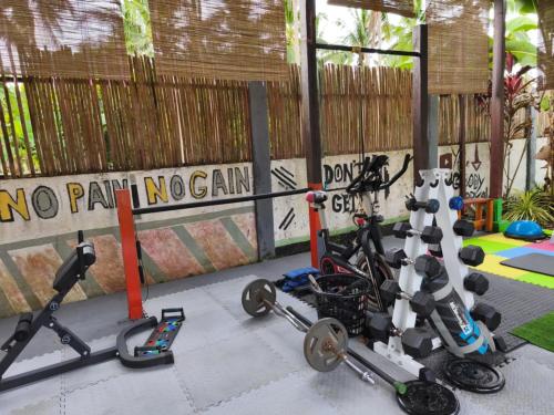 a group of exercise bikes parked next to a fence at Selectum Mangrove Resort in Panglao