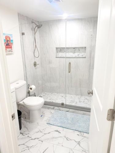 a bathroom with a toilet and a shower at Shore Thing in Wildwood