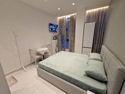 Ένα ή περισσότερα κρεβάτια σε δωμάτιο στο ELOFIRA RoomS