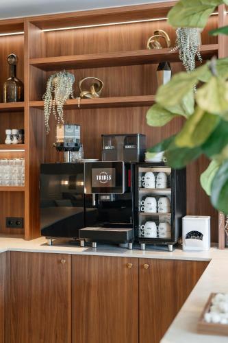 a coffee shop with a coffee machine on a counter at Malie House in Utrecht