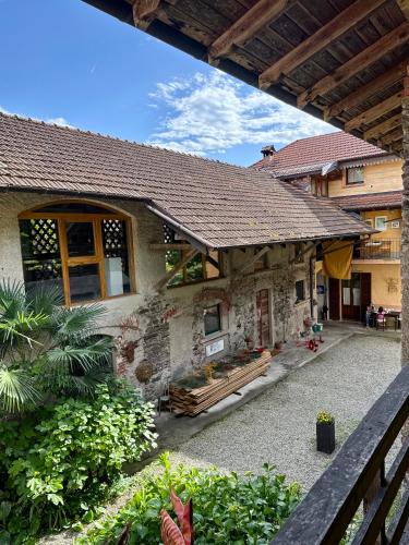 a stone house with a bench in front of it at Magic Garden - Since 1911 in Luino