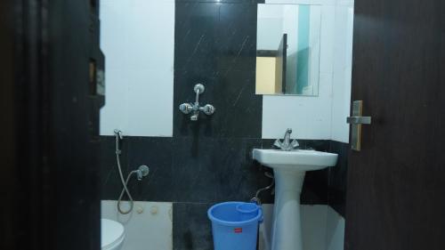 a bathroom with a sink and a mirror at hotel kishangarh jaisalmer in Jaisalmer