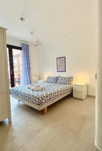 Llit o llits en una habitació de Residence Borgo Punta Villa