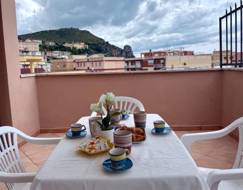 a table with food and a view of a city at Morosini 43 in Terracina