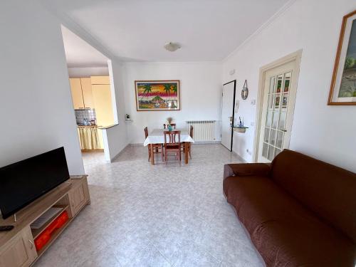 a living room with a couch and a table at Morosini 43 in Terracina