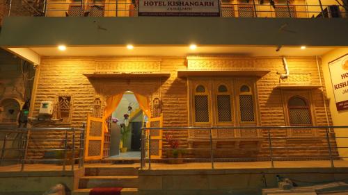 a brick building with an arch in front of it at hotel kishangarh jaisalmer in Jaisalmer