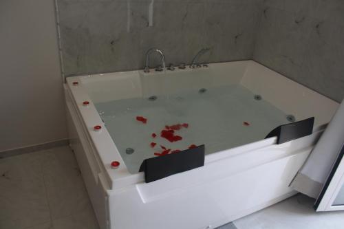 a bath tub with blood on it in a bathroom at Encanto Suites by La Sirenetta in Taormina