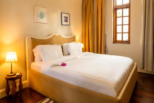 Uma cama ou camas num quarto em Olma Hotel & Suites
