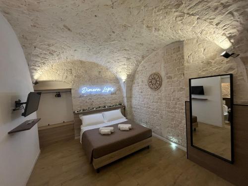 Una cama o camas en una habitación de Dimora Lapis