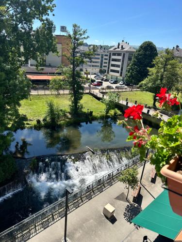 a view of a pond in a park at El Malecon in Sarria
