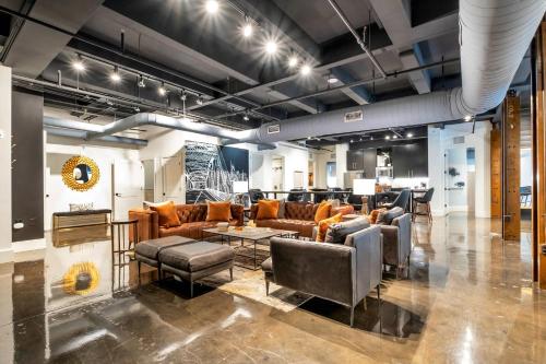 a lobby with couches and chairs in a room at Modern Suite 6BR by Maddox Hotel in Nashville