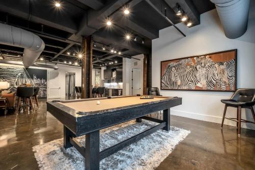 a billiard room with a pool table in the middle at Modern Suite 6BR by Maddox Hotel in Nashville
