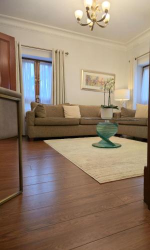 a living room with a couch and a table at CARLTON COURT - MAYFAIR in London