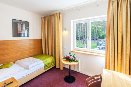 Säng eller sängar i ett rum på Hotel Port Doksy