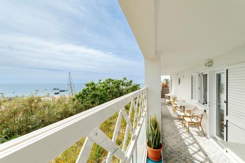 a balcony with a view of the ocean at Appartamenti Casa del Sole in Ischia