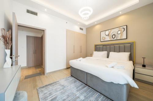a bedroom with a large white bed and a rug at ZAPBED House - Luxury Holiday Homes in Yas Island in Abu Dhabi
