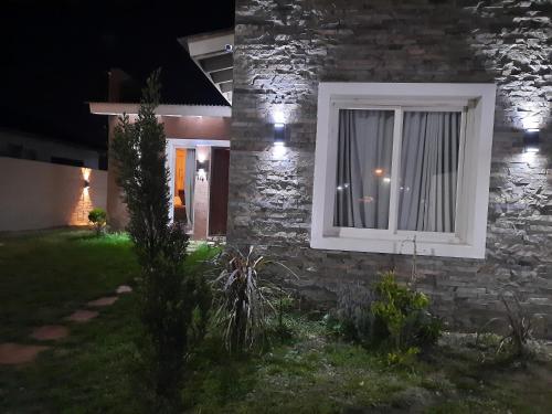 a brick house with a window at night at SILVIA in Ostende