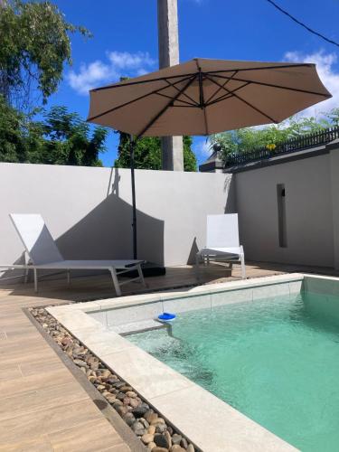 Πισίνα στο ή κοντά στο Mont Choisy Garden Patio Apartment Close to Beach