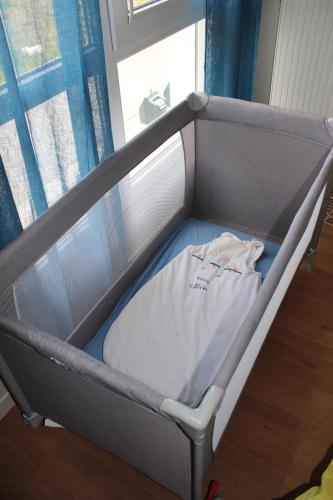 Ένα ή περισσότερα κρεβάτια σε δωμάτιο στο Appartement Cosy Proche Disneyland - tout Confort