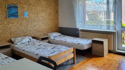 Postel nebo postele na pokoji v ubytování Pokoje Ekonomiczne