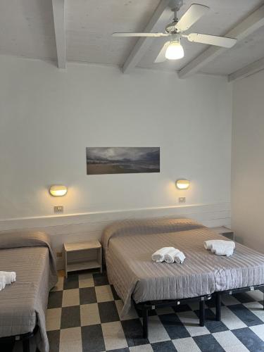 Ένα ή περισσότερα κρεβάτια σε δωμάτιο στο Hotel Roma