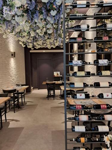 a wine rack filled with lots of wine bottles at Hotel Minerva in Siena