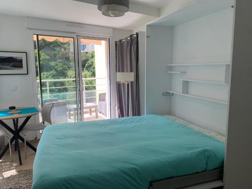Postel nebo postele na pokoji v ubytování Studio chambre Hôte