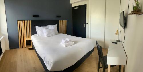 Katil atau katil-katil dalam bilik di Auberge anglefort