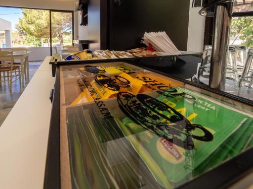 a display of skis on a counter in a restaurant at Finikounda Hotel in Finikounta