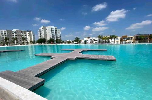 a swimming pool with a cross in the water at Increible Apartment with beach Monterrey/Apodaca in Monterrey