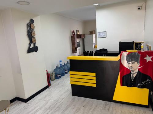an office with a bar with a picture of a man at Pin Suite in Buyukcekmece