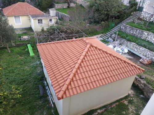 an orange tiled roof on a house at Sofias house at Agkona Kefalonia in Angón