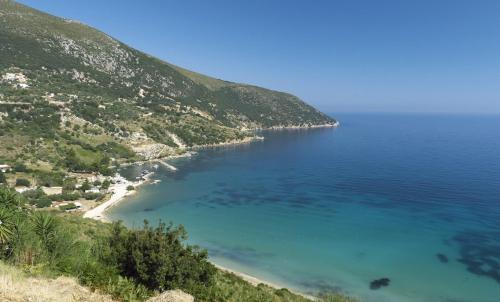 a view of a beach next to a mountain at Sofias house at Agkona Kefalonia in Angón