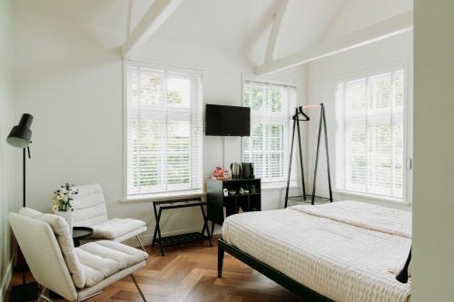 Ένα ή περισσότερα κρεβάτια σε δωμάτιο στο Boutique B&B Oud Aa