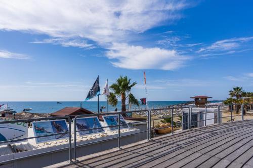 a boardwalk with a view of the beach at Kraken 2-Bedroom Apartment in Larnaka
