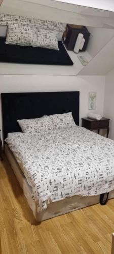 a bedroom with a bed with a sheet with music at Barok in Tešanj