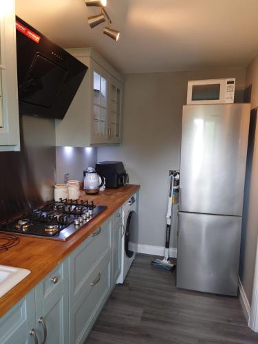 Una cocina o zona de cocina en Beautiful fully renovated flat in Didcot