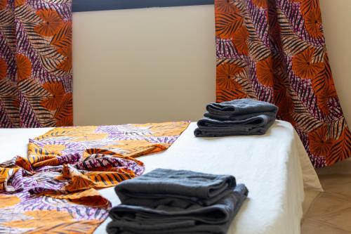 a table with black shirts sitting on top of it at Aparthotel Tropical Bounty Beach L02 in Santa Maria